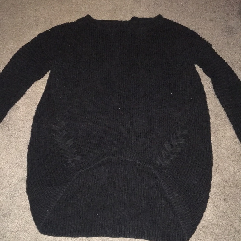 Three quarter sleeve black sweater.